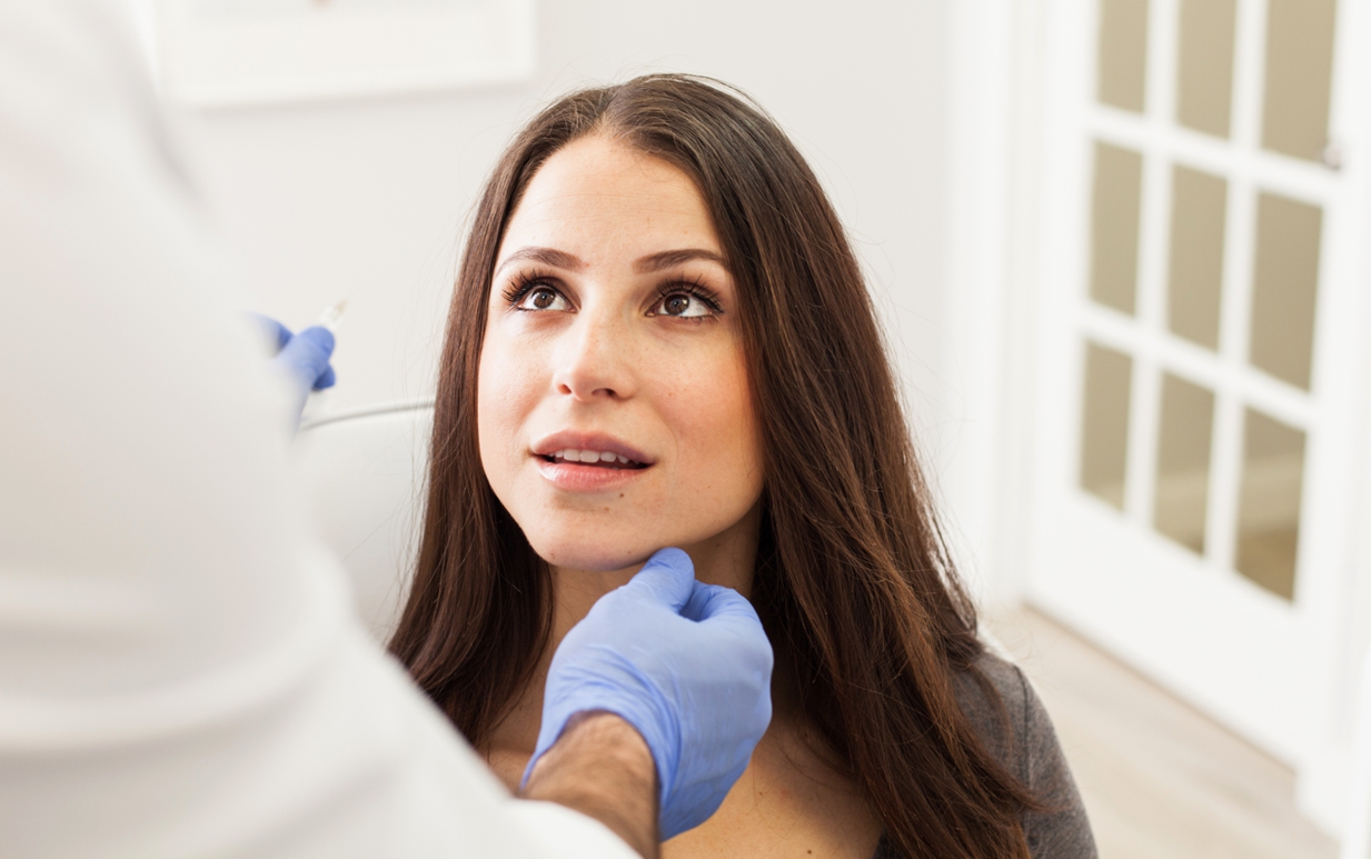 Woman getting a consultation with a dermatologist